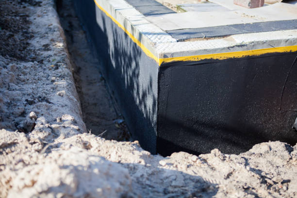 Professional Waterproofing technician working in Falkville, AL